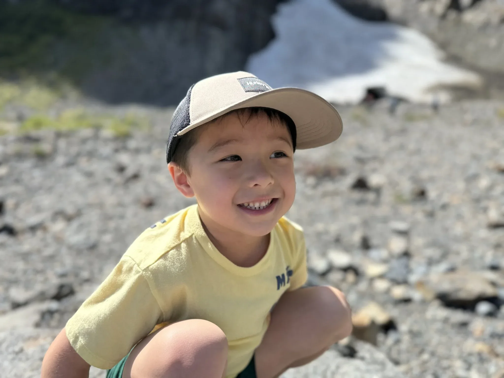 My grandson posing for a picture with the ice caves in the background.