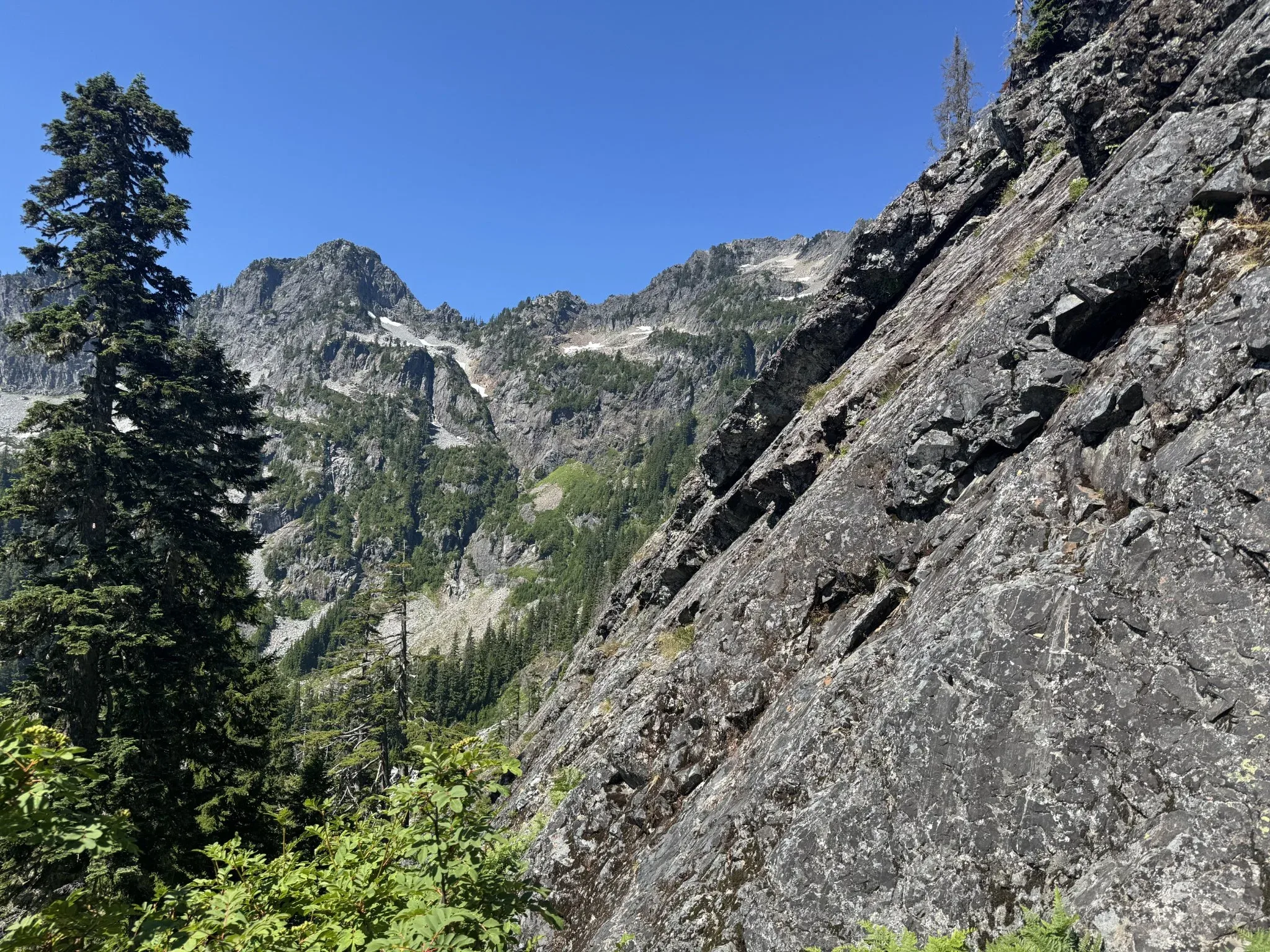 View of the area that includes a large rock wall on the hillside.